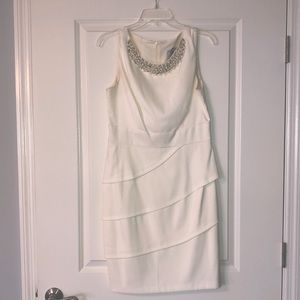 White cocktail dress with Pearl neckline, ruffled bottom